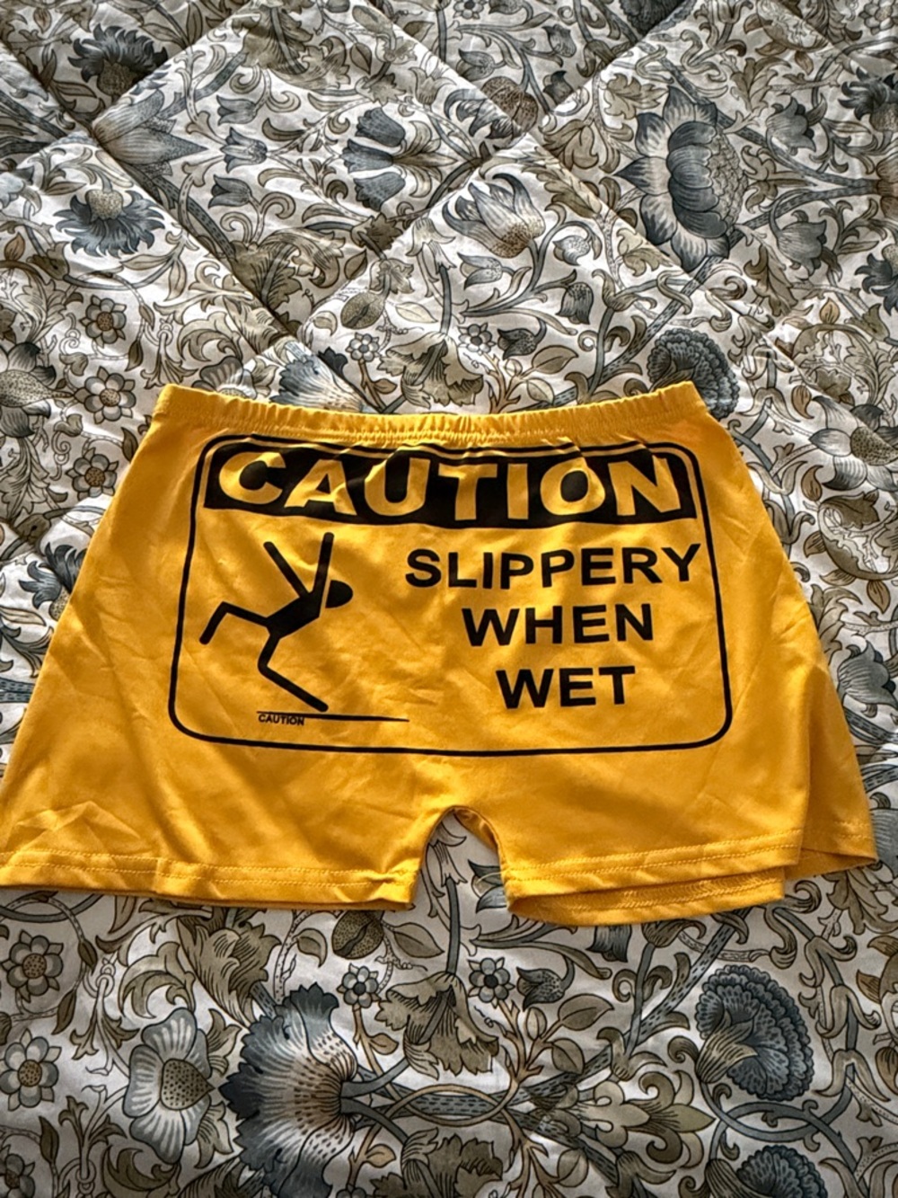 Yellow "Caution Slippery When Wet" Graphic Shorts. GAG GIFT NEVER WORN